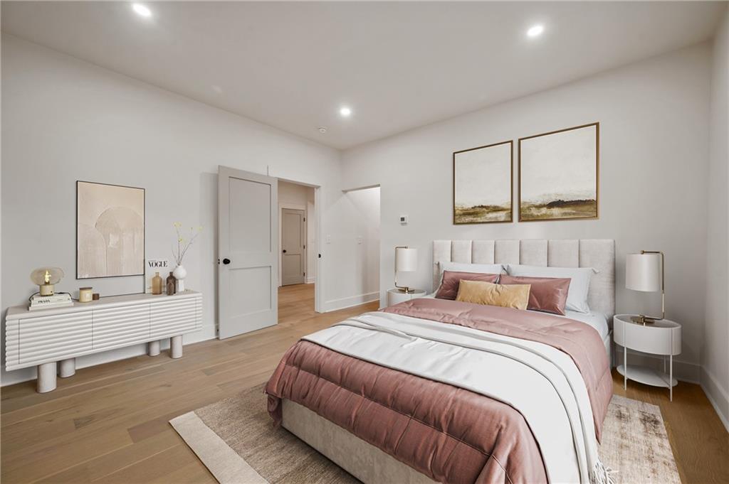 5563 Hampton Street Pittsburgh, PA 15206 - Photo 18 of 29 a bedroom with a bed and a couch