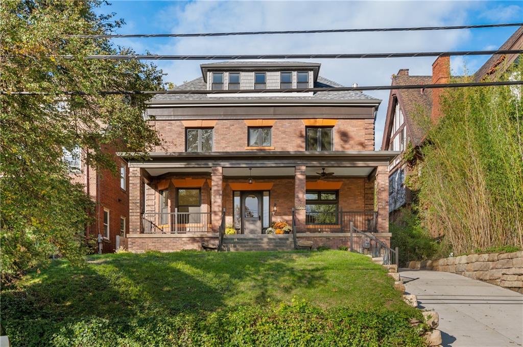 5563 Hampton Street Pittsburgh, PA 15206 - Photo 2 of 29 front view of house with a yard
