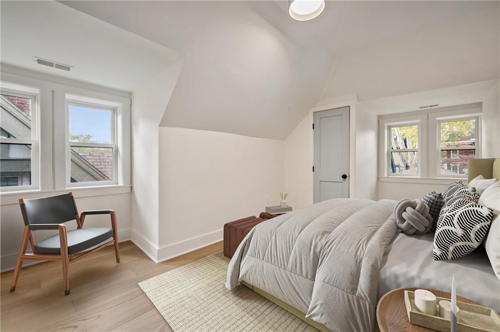 5563 Hampton Street Pittsburgh, PA 15206 - Photo 21 of 29 a bedroom with a bed and a window