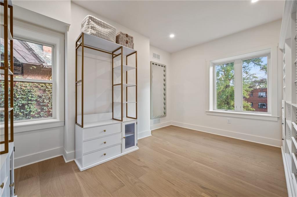 5563 Hampton Street Pittsburgh, PA 15206 - Photo 24 of 29 an empty room with windows and closet
