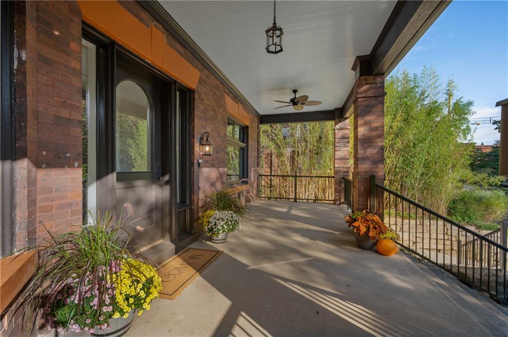 5563 Hampton Street Pittsburgh, PA 15206 - Photo 3 of 29 a view of a porch with a floor to ceiling window and wooden fence