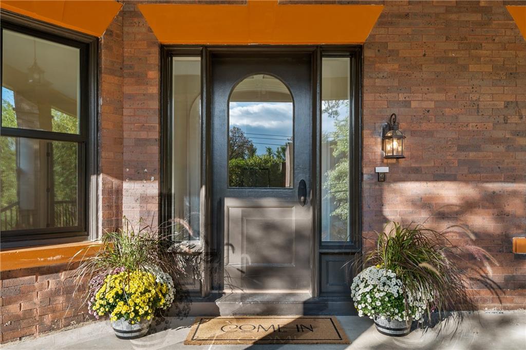 5563 Hampton Street Pittsburgh, PA 15206 - Photo 4 of 29 a front view of a house with garden