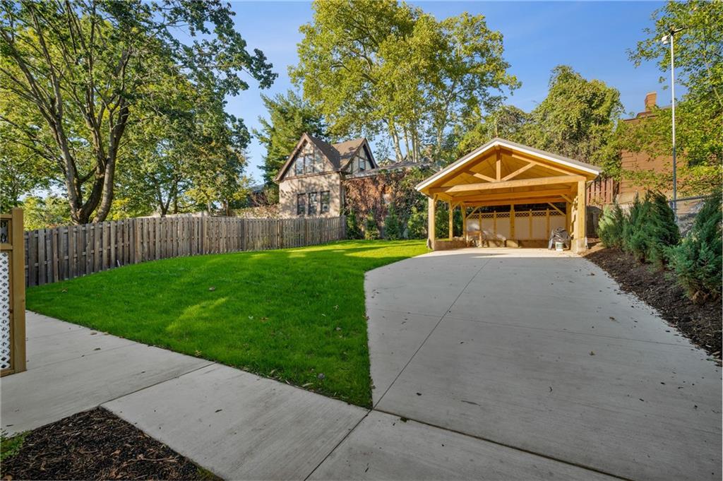 5563 Hampton Street Pittsburgh, PA 15206 - Photo 5 of 29 a front view of a house with a yard