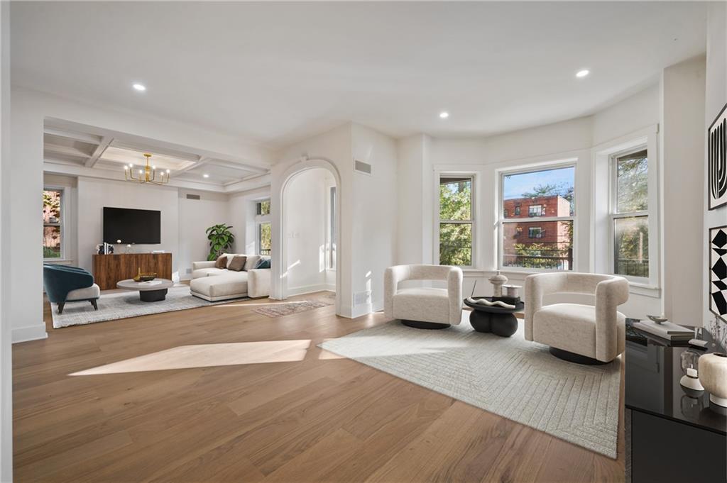 5563 Hampton Street Pittsburgh, PA 15206 - Photo 9 of 29 a living room with furniture and a flat screen tv