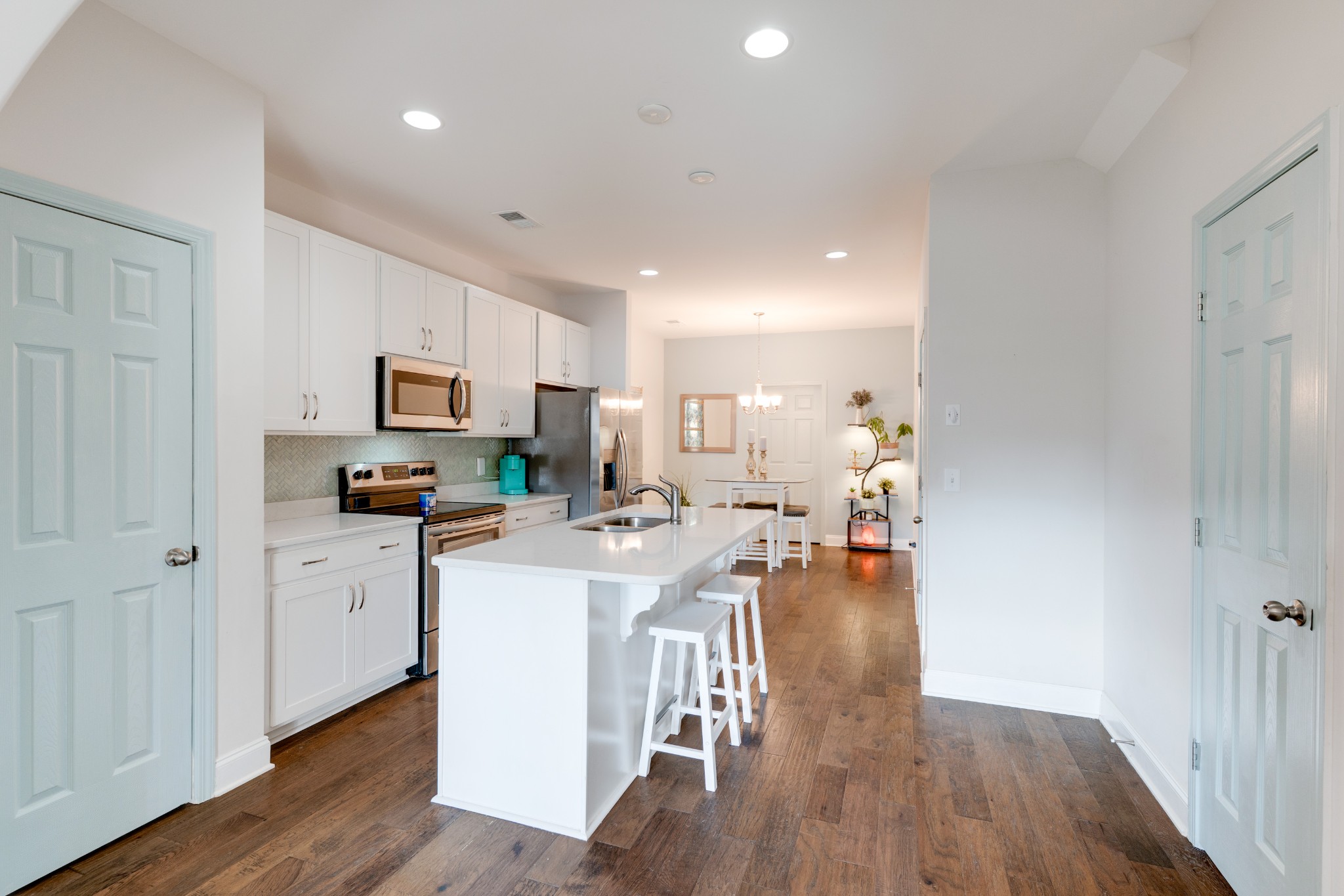 420 Longstone Road Gallatin, TN 37066 - Photo 6 of 24 a kitchen with a sink a stove cabinets and wooden floor