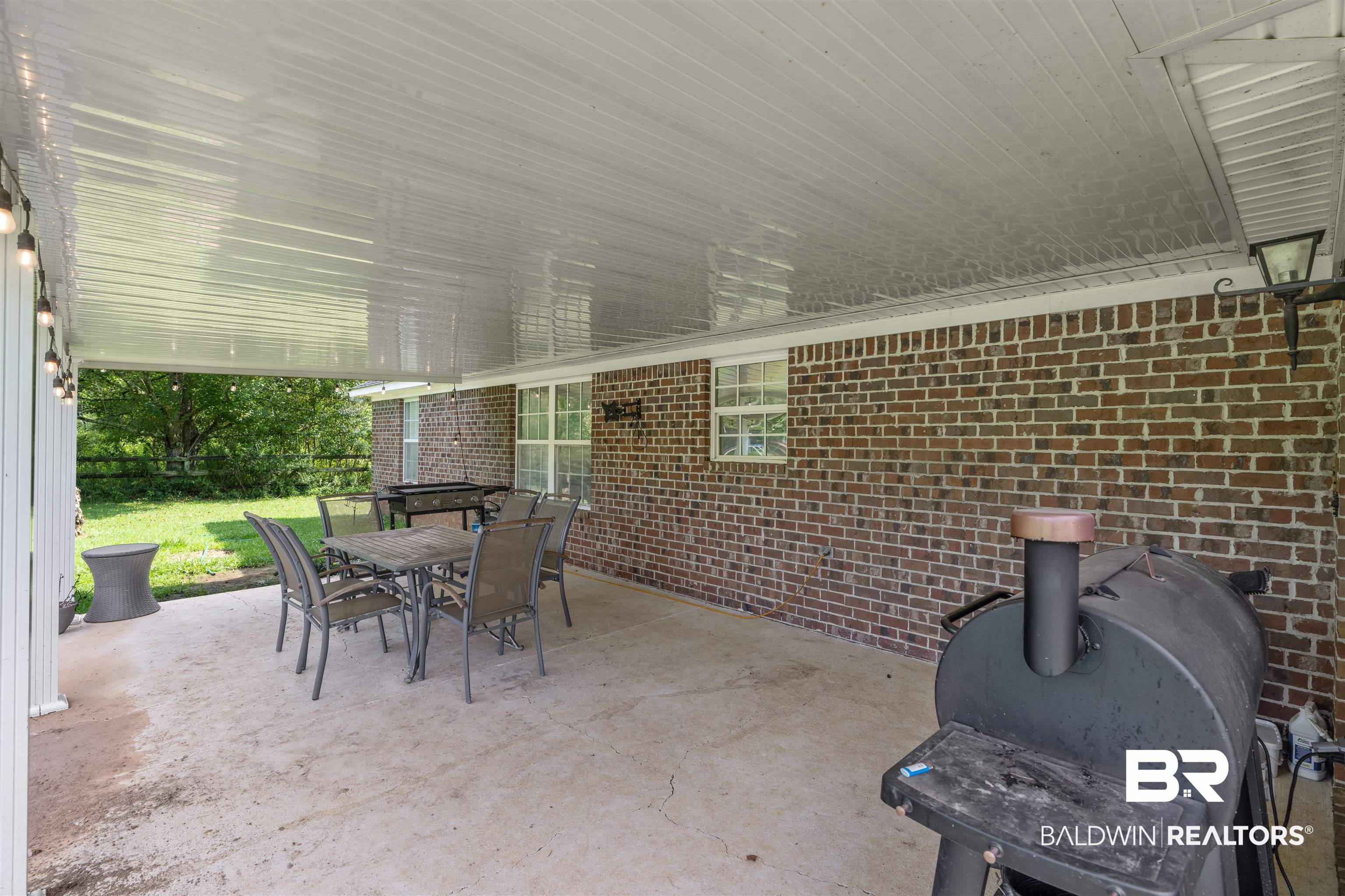 34711 Pond Road Stapleton, AL 36578 - Photo 23 of 38 View of patio / terrace featuring outdoor dining space and area for grilling
