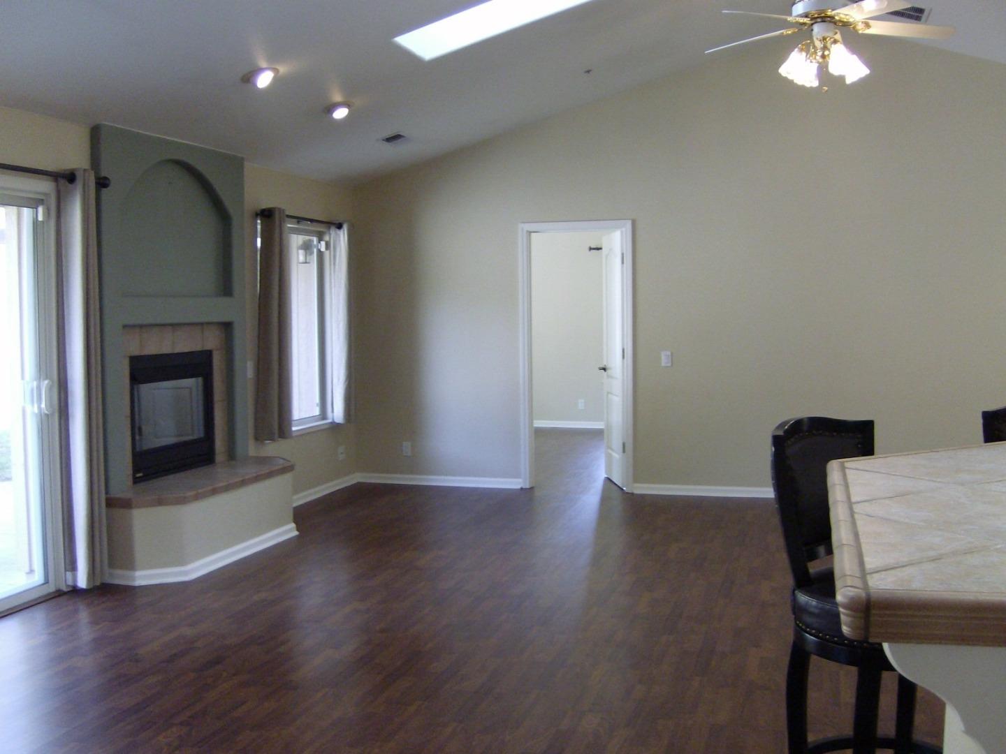 821 Lewis Road Watsonville, CA 95076 - Photo 8 of 15 a view of a livingroom with wooden floor and a fireplace
