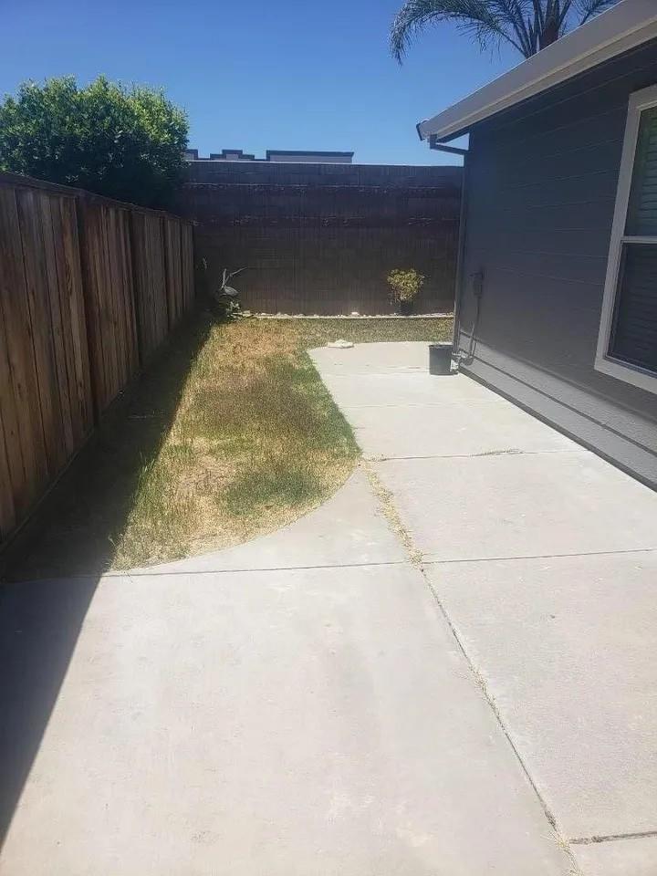 830 Capitola Drive Hollister, CA 95023 - Photo 5 of 14 a view of backyard with wooden floor