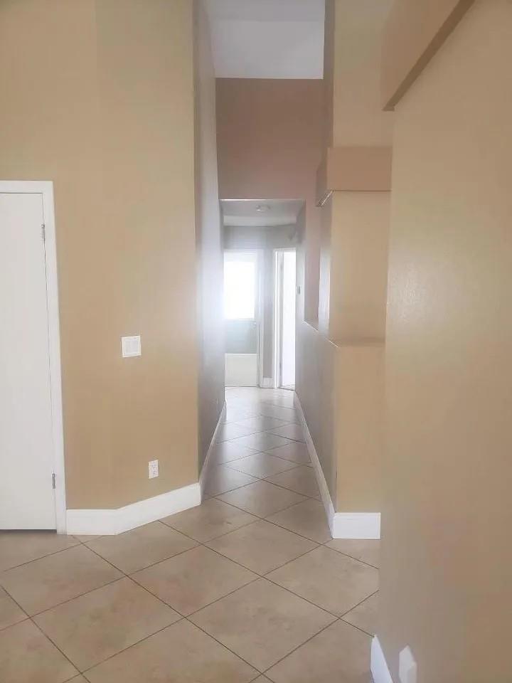 830 Capitola Drive Hollister, CA 95023 - Photo 10 of 14 a view of a hallway with wooden floor