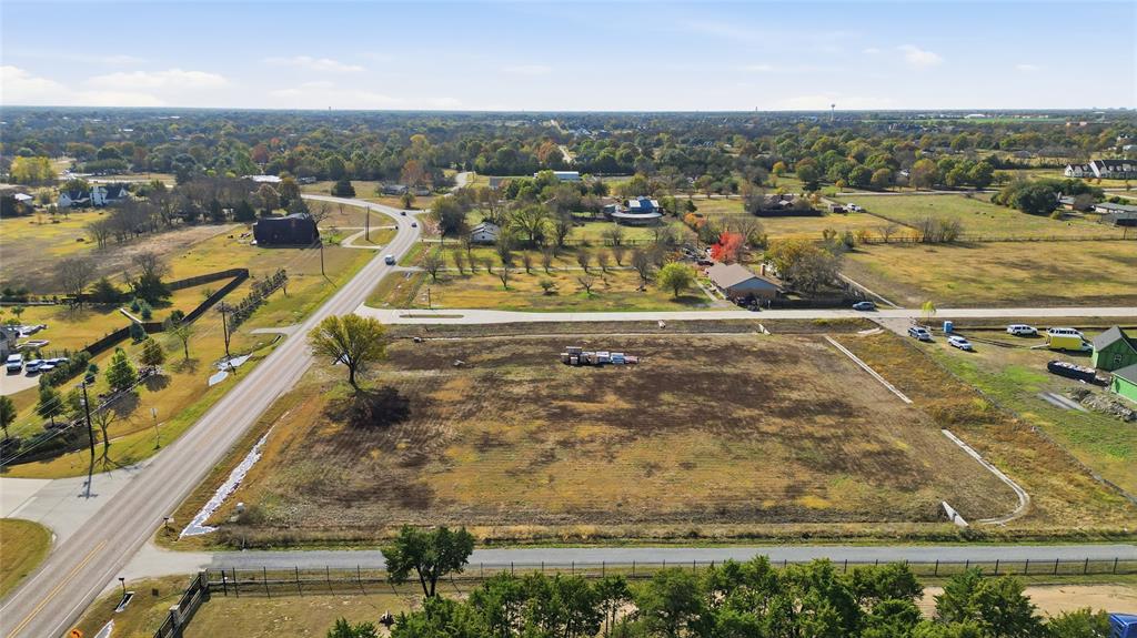1750 New Castle Court Lucas, TX 75002 - Photo 5 of 8 an aerial view of residential houses with outdoor space