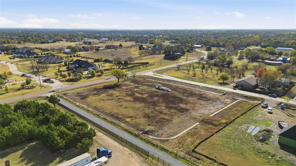 1750 New Castle Court Lucas, TX 75002 - Photo 6 of 8 an aerial view of residential houses with outdoor space