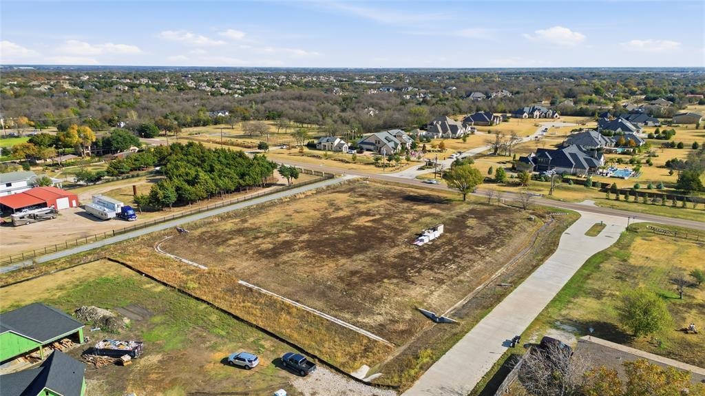 1750 New Castle Court Lucas, TX 75002 - Photo 7 of 8 an aerial view of residential houses with outdoor space