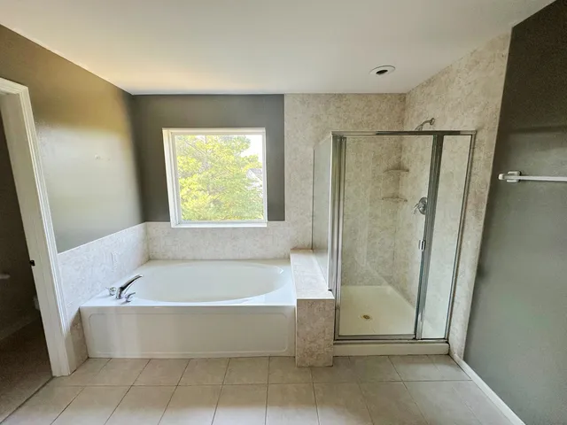 a large bathroom with a double vanity sink and a mirror