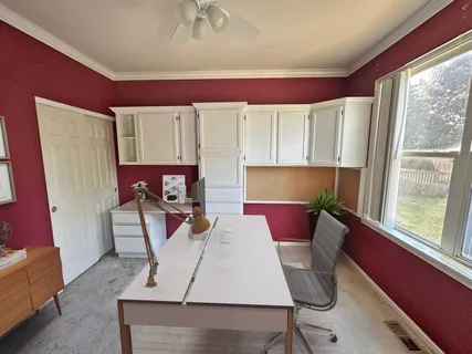 a room with furniture and a window