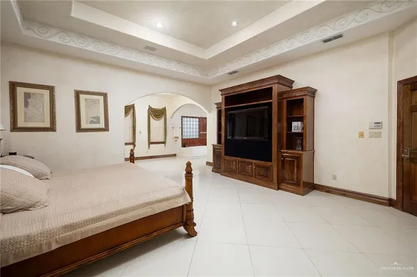 a bedroom with a bed and dresser