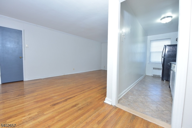 44 Union Street, Unit 6 Montclair, NJ 07042 - Photo 3 of 12 wooden floor in a hall with an empty room