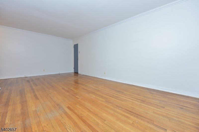 44 Union Street, Unit 6 Montclair, NJ 07042 - Photo 5 of 12 a view of empty room with wooden floor