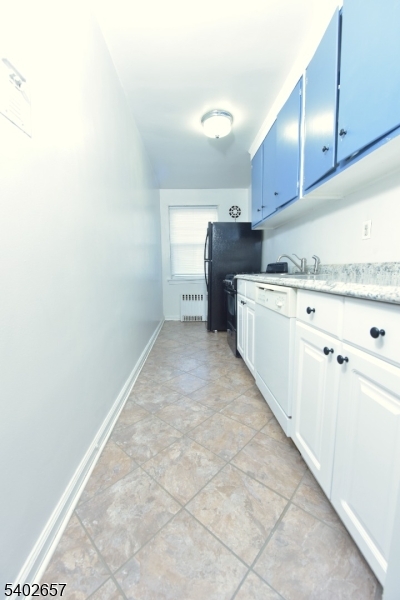 44 Union Street, Unit 6 Montclair, NJ 07042 - Photo 6 of 12 a kitchen with granite countertop a sink and cabinets