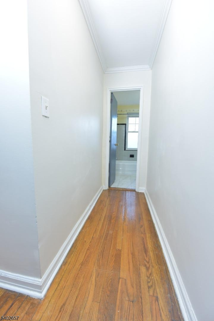 44 Union Street, Unit 6 Montclair, NJ 07042 - Photo 9 of 12 a view of a room with wooden floor and bench