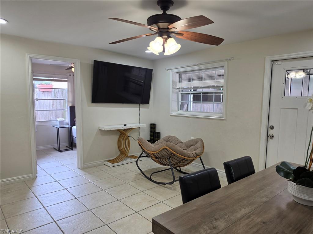 5230 Warren Street Naples, FL 34113 - Photo 12 of 22 Tile flooring throughout, white walls, and a ceiling fan with light fixture