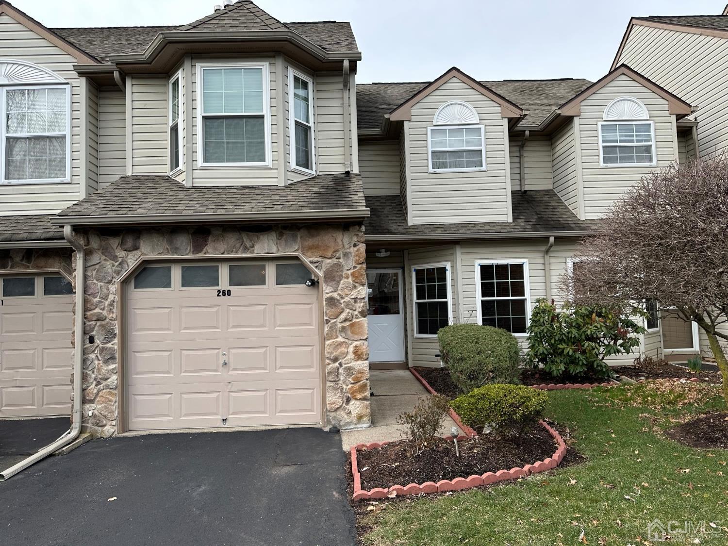260 Nebula Road Piscataway, NJ 08854 - Photo 1 of 46 a front view of a house with a yard and garage