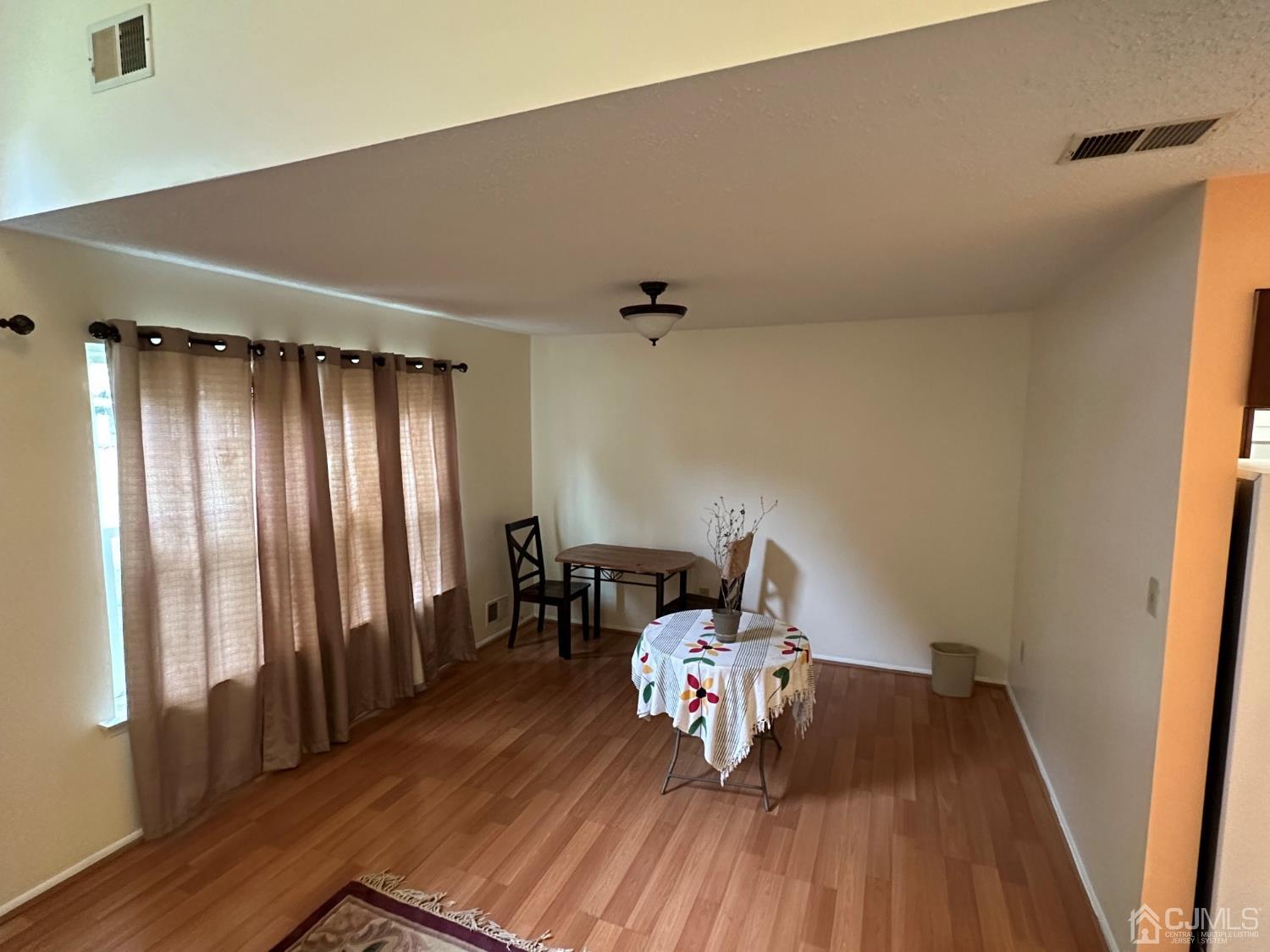 260 Nebula Road Piscataway, NJ 08854 - Photo 19 of 46 a view of a livingroom with furniture and wooden floor