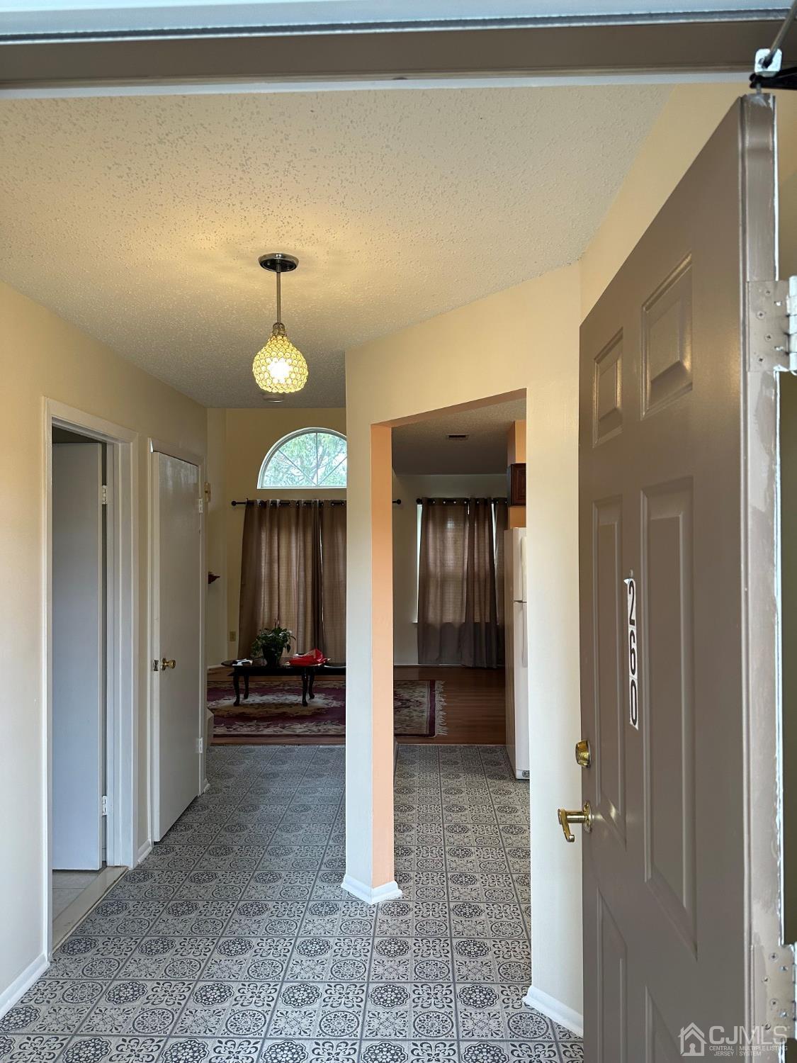 260 Nebula Road Piscataway, NJ 08854 - Photo 27 of 46 a view of a hallway with a livingroom and a bathroom