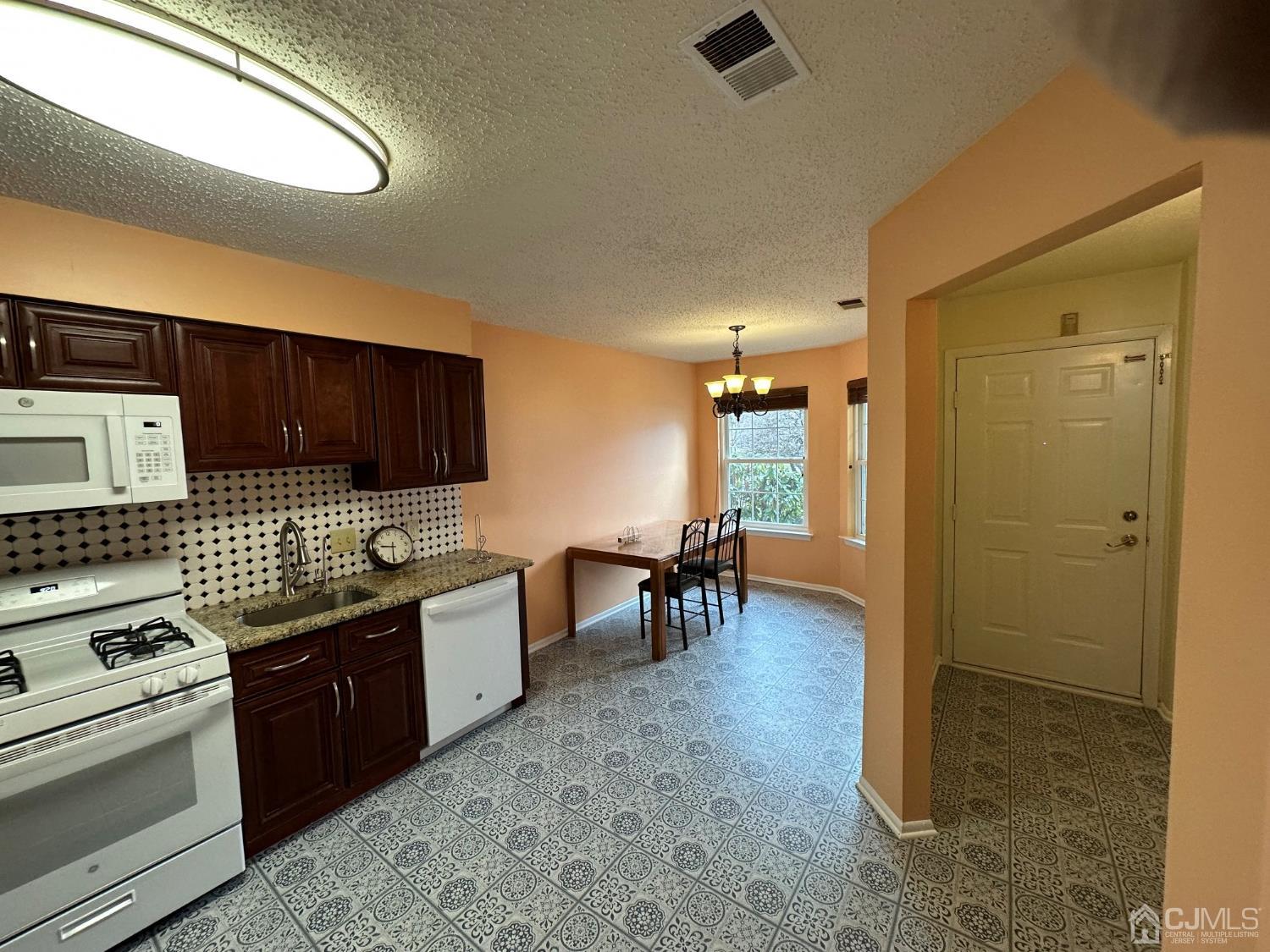 260 Nebula Road Piscataway, NJ 08854 - Photo 28 of 46 a kitchen with a sink and a stove top oven