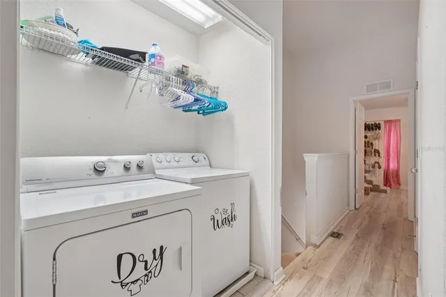 a utility room with dryer and washer