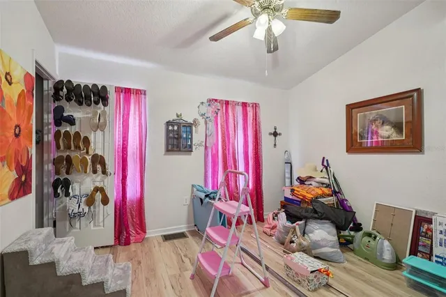 a bedroom with furniture and a chandelier