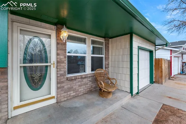 a view of a door and chair in the porch