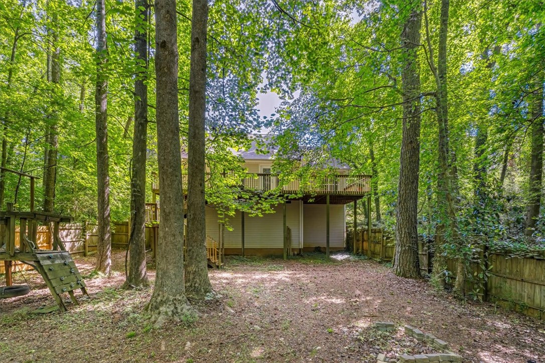 210 Briarcliff Road Central, SC 29630 - Photo 38 of 39 This elevated rear exterior offers a spacious deck overlooking a lush, private yard.