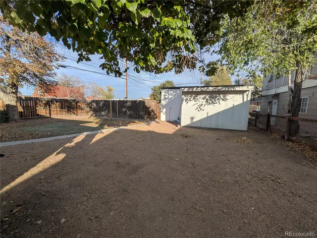 a view of a street with a building in the background