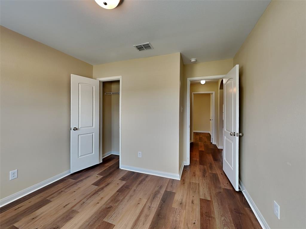 1334 Barrel Drive Dallas, TX 75253 - Photo 4 of 15 a view of a hallway with wooden floor