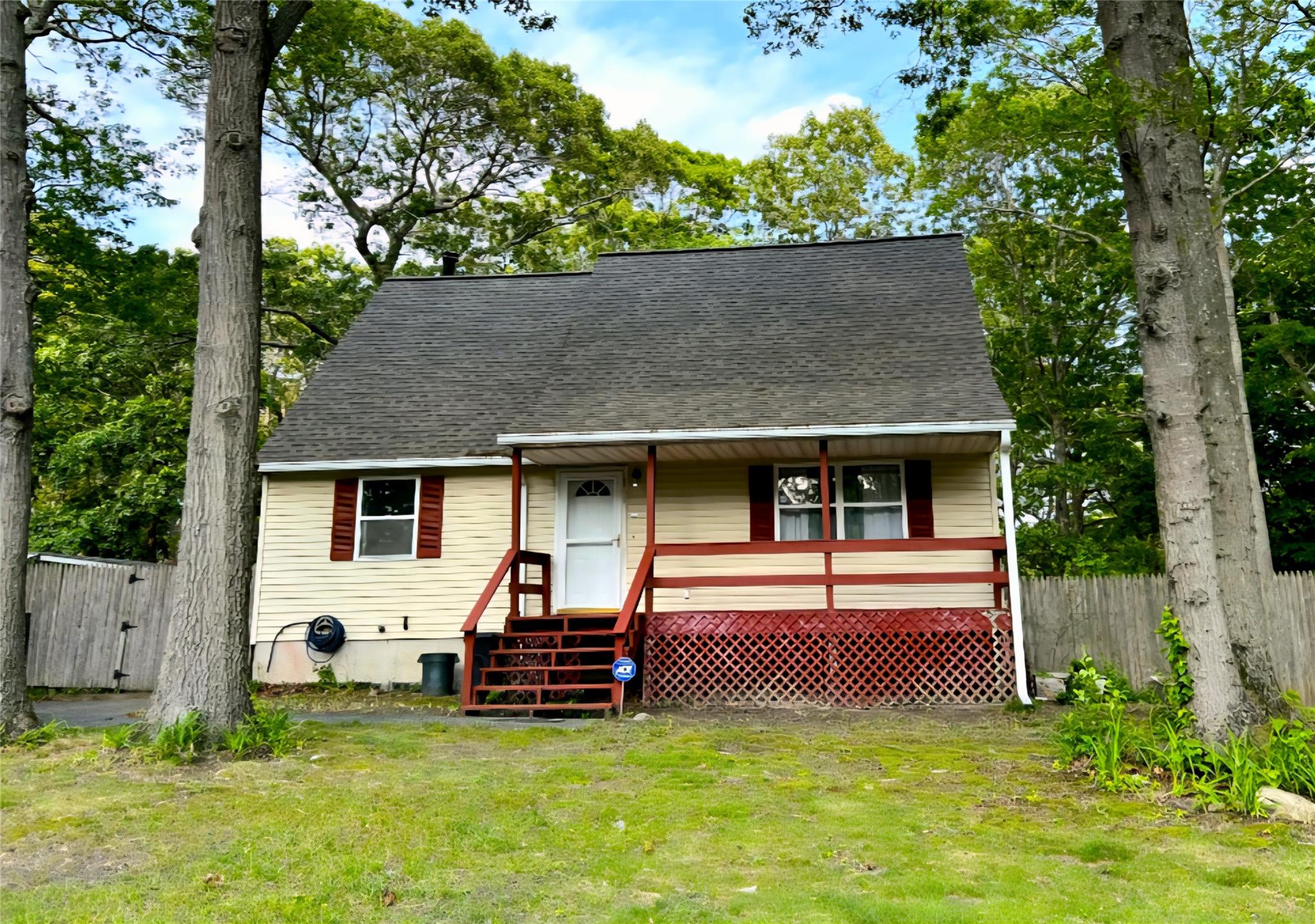 View of front of house featuring a shingled roof