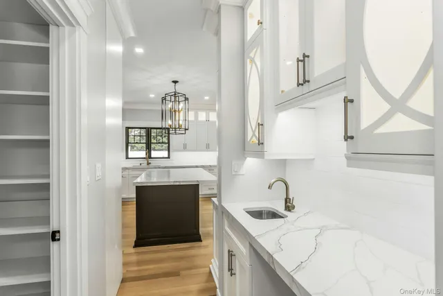 a kitchen with a stove and a wooden floors
