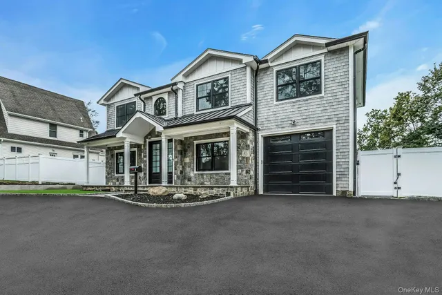 a front view of a house with a garage