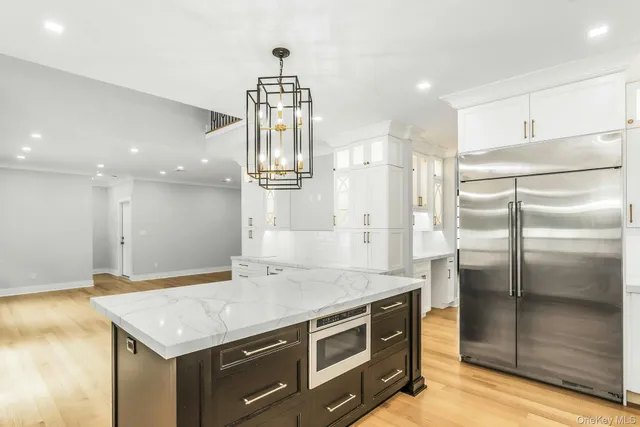 a view of a house with swimming pool and a yard