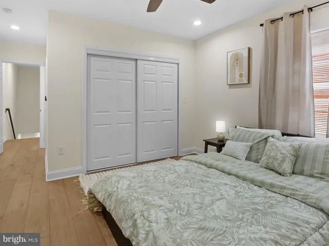 a bedroom with a bed and a couch