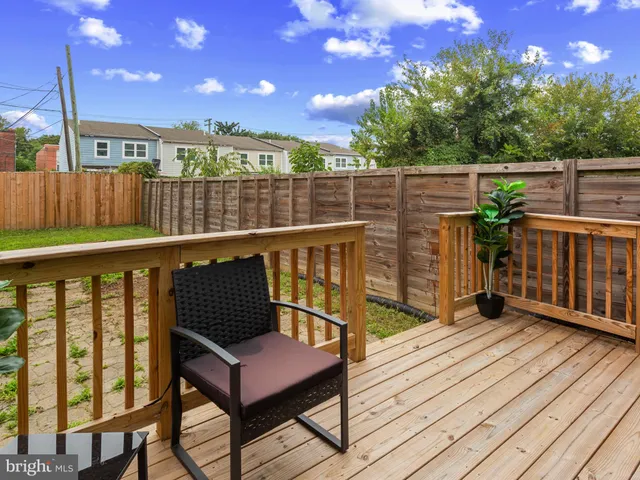 a view of a wooden deck with a bench