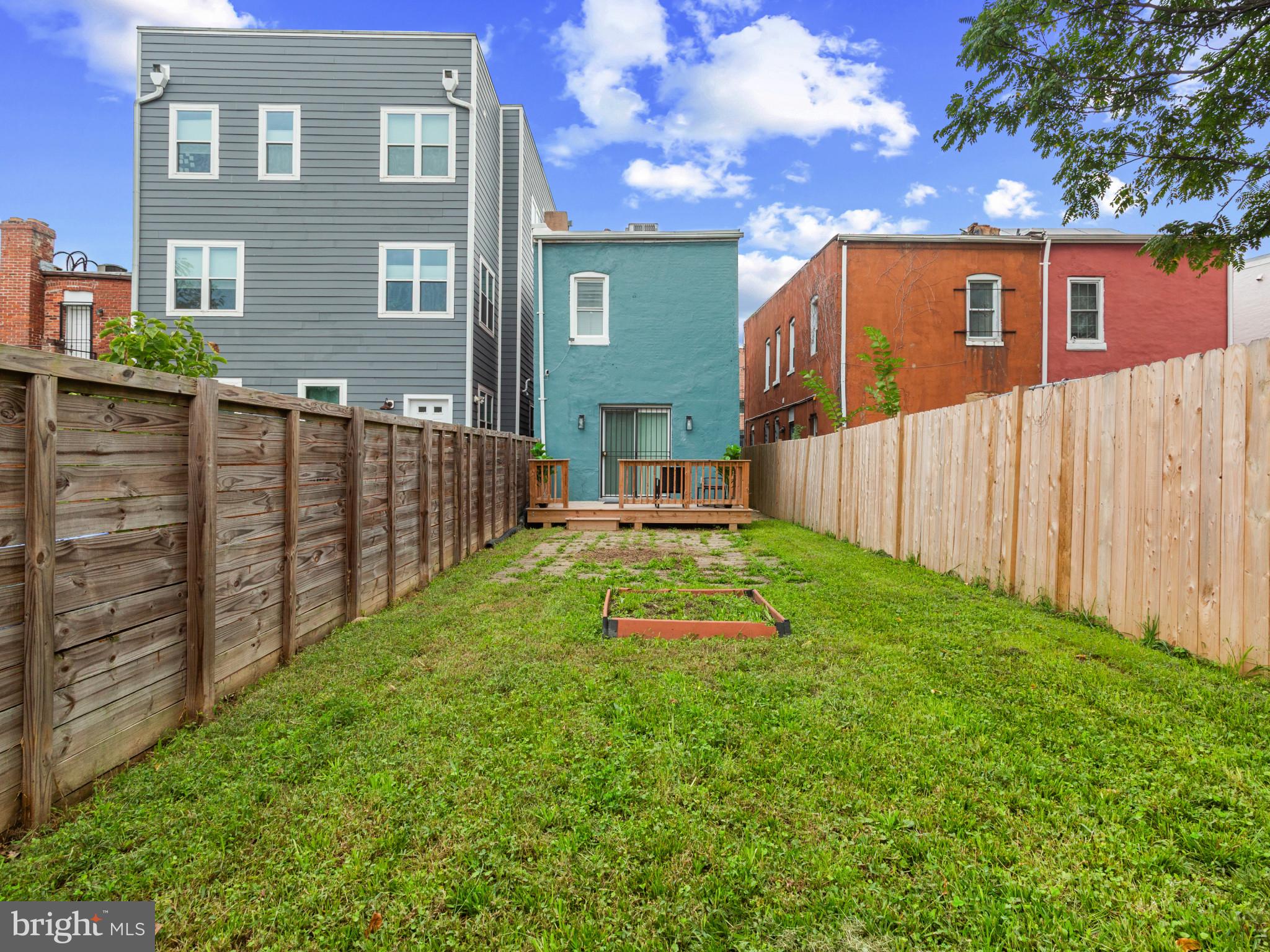 1834 Providence Street Northeast Washington, DC 20002 - Photo 24 of 25 a view of backyard with garden and wooden fence