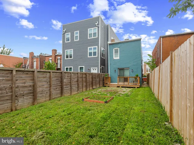 a view of a brick wall in front of a building