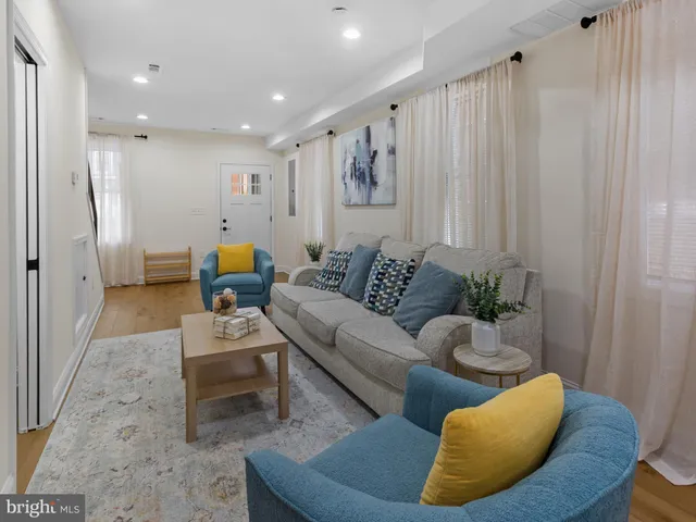 a living room with furniture and a rug