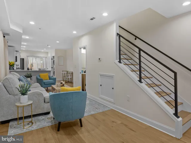 a living room with furniture and a rug