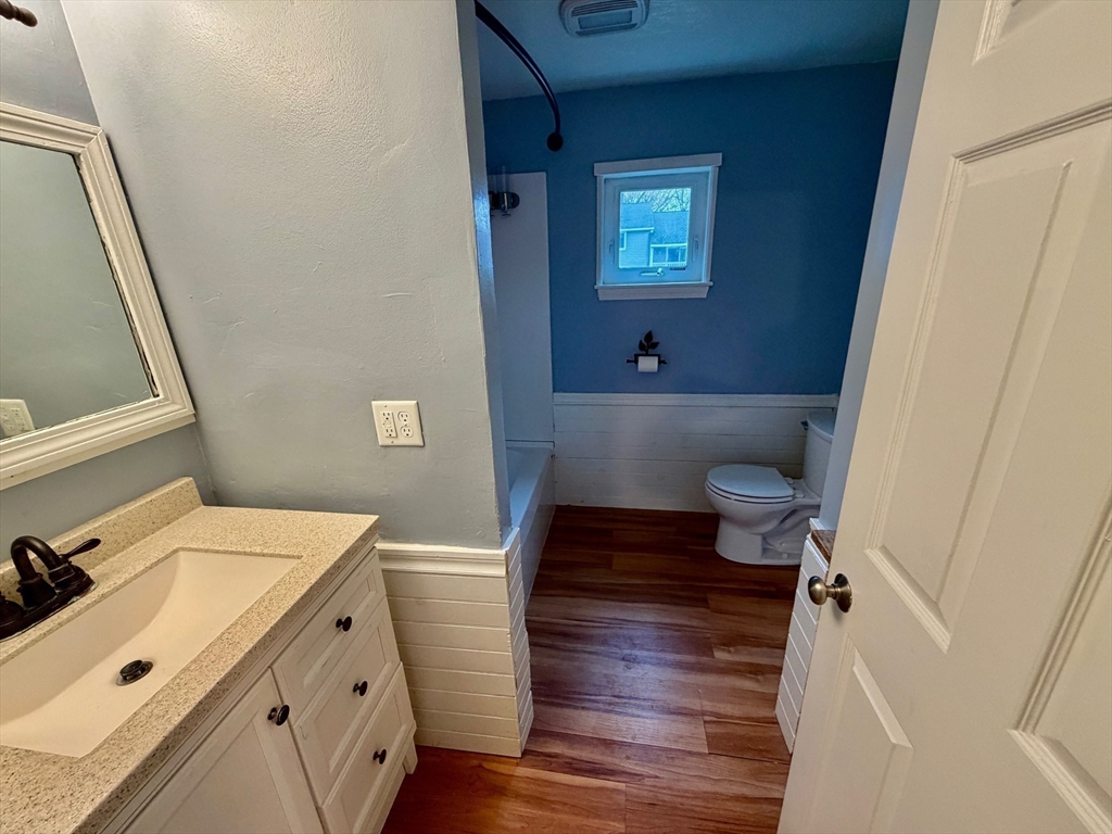13 Beal's Cove Road, Unit K Hingham, MA 02043 - Photo 7 of 7 a bathroom with a sink and a mirror
