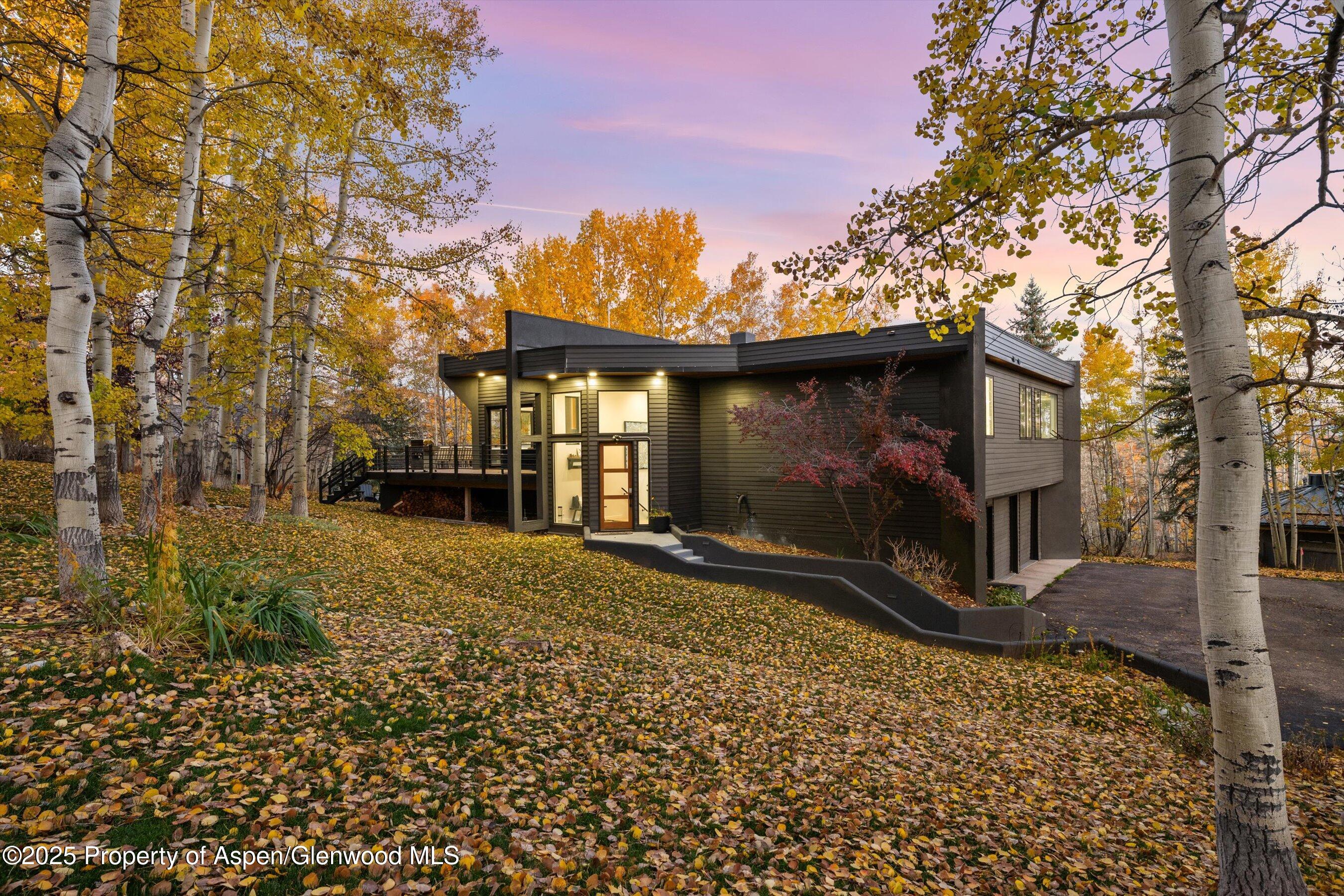 233 Stellar Lane Snowmass Village, CO 81615 - Photo 1 of 43 a view of a house with a yard