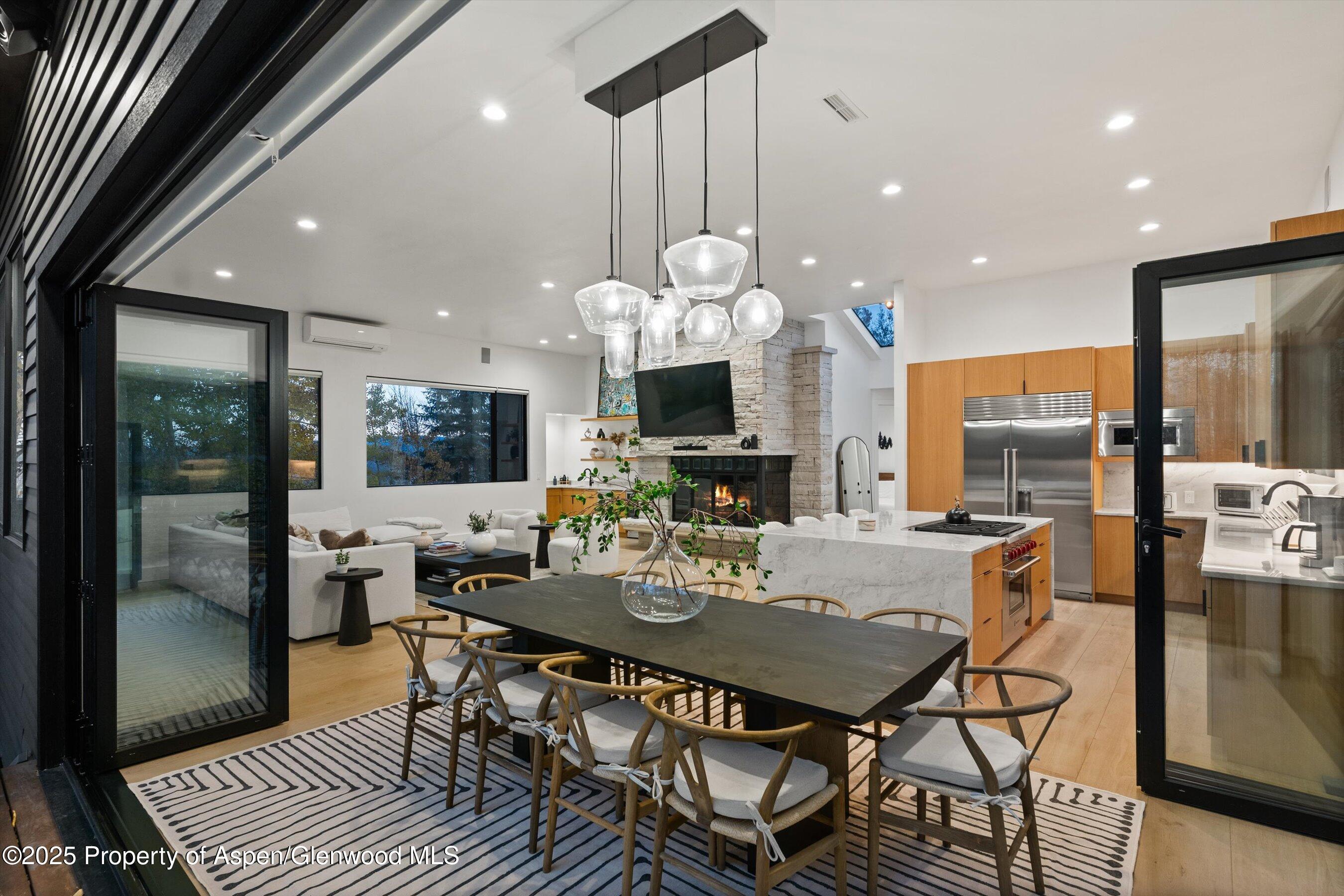 233 Stellar Lane Snowmass Village, CO 81615 - Photo 12 of 43 a view of a dining room with furniture window and wooden floor