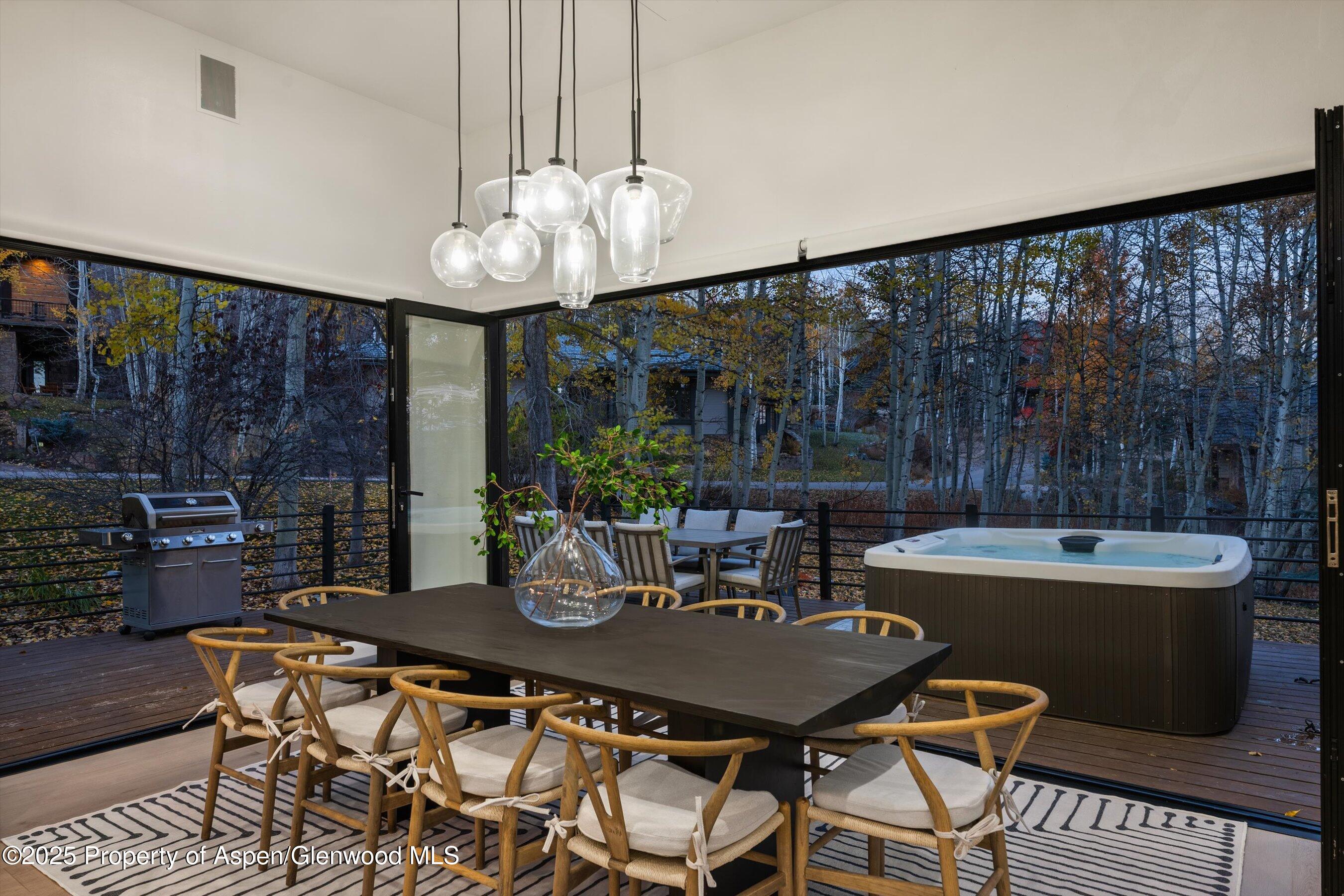 233 Stellar Lane Snowmass Village, CO 81615 - Photo 13 of 43 a view of a dining room with furniture window and outside view