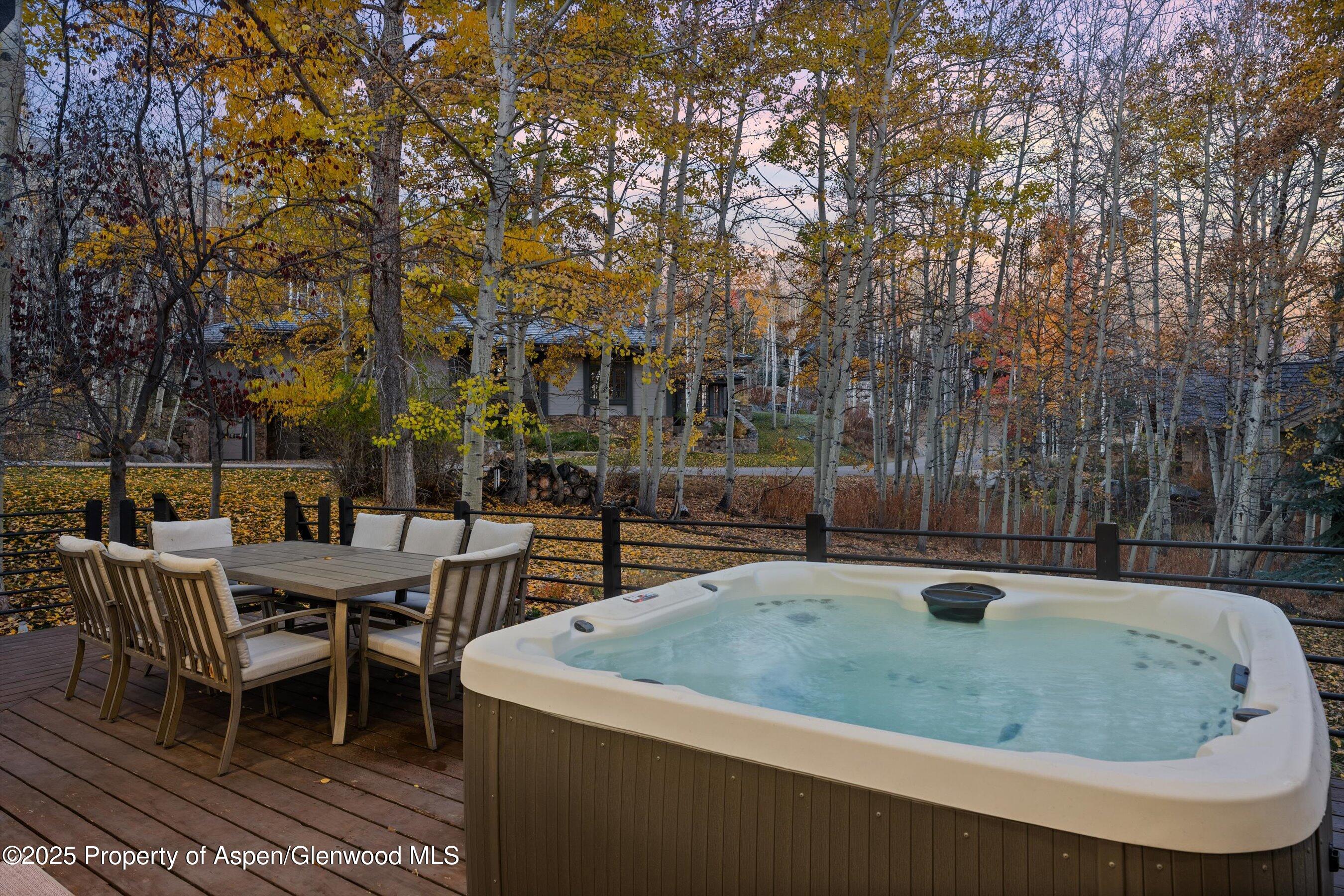 233 Stellar Lane Snowmass Village, CO 81615 - Photo 17 of 43 a backyard of a house with yard barbeque oven and outdoor seating