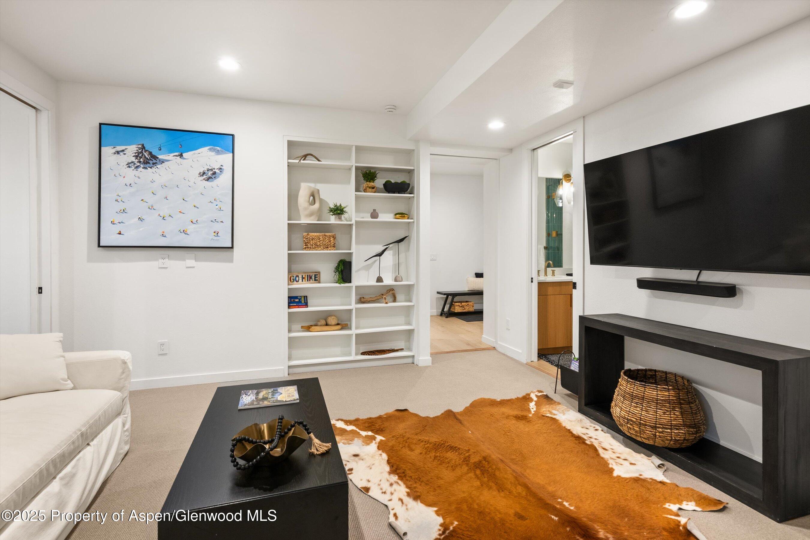 233 Stellar Lane Snowmass Village, CO 81615 - Photo 31 of 43 a living room with furniture and a flat screen tv